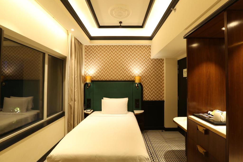 Postel nebo postele na pokoji v ubytování The Connaught, New Delhi- IHCL SeleQtions
