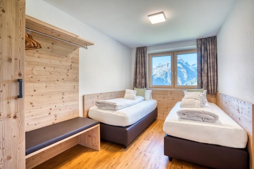 Postel nebo postele na pokoji v ubytování HUS23 with Wellness