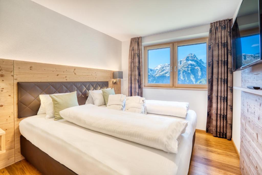 Postel nebo postele na pokoji v ubytování HUS23 with Wellness