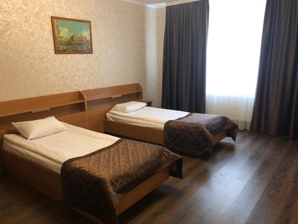 Postel nebo postele na pokoji v ubytování Comfort Hotel