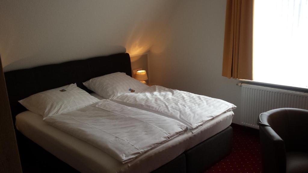 Postel nebo postele na pokoji v ubytování Hotel Bohlje