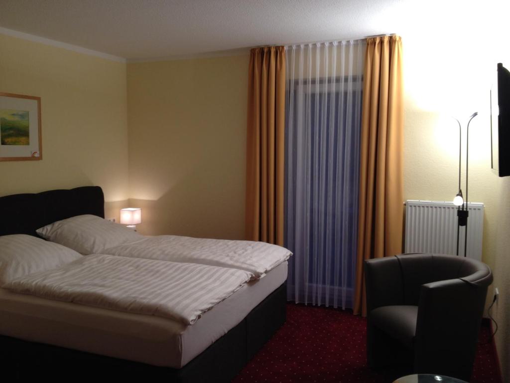 Postel nebo postele na pokoji v ubytování Hotel Bohlje