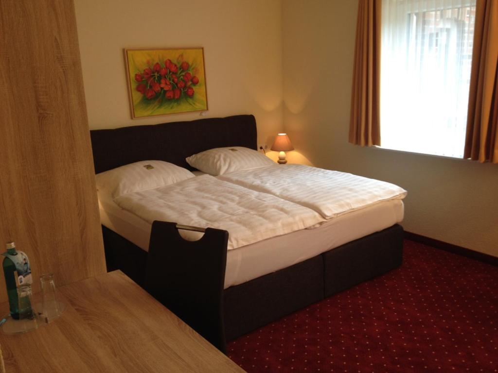 Postel nebo postele na pokoji v ubytování Hotel Bohlje