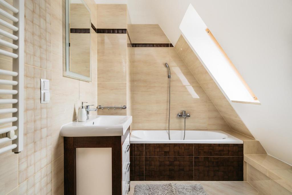 Kúpeľňa v ubytovaní Apartamenty Domino - Kościelisko