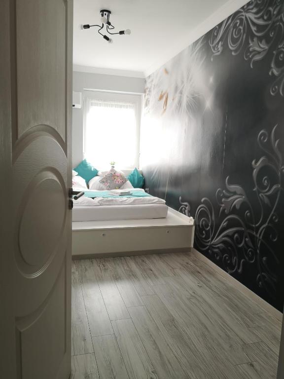 Postel nebo postele na pokoji v ubytování Centrum Luxus Apartman