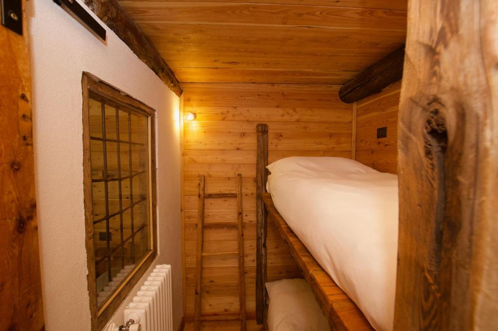 Postel nebo postele na pokoji v ubytování L'Escola e Lou Mulin
