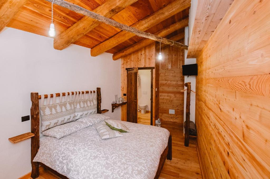 Postel nebo postele na pokoji v ubytování L'Escola e Lou Mulin