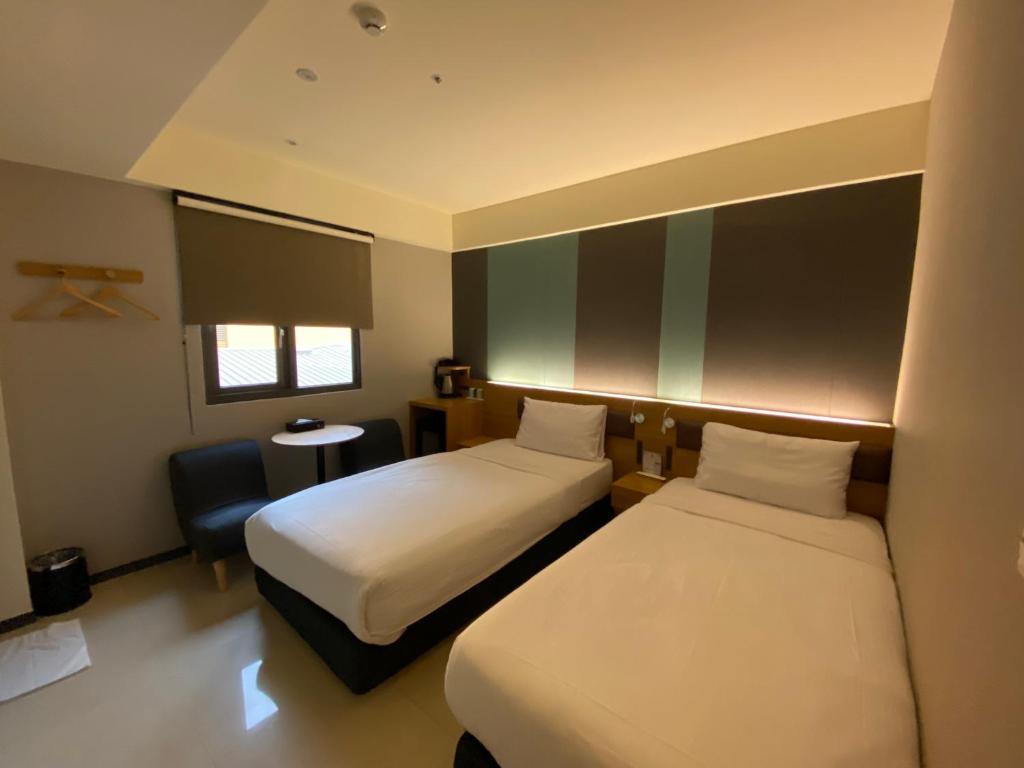 Letto o letti in una camera di Fu Kuang Hotel
