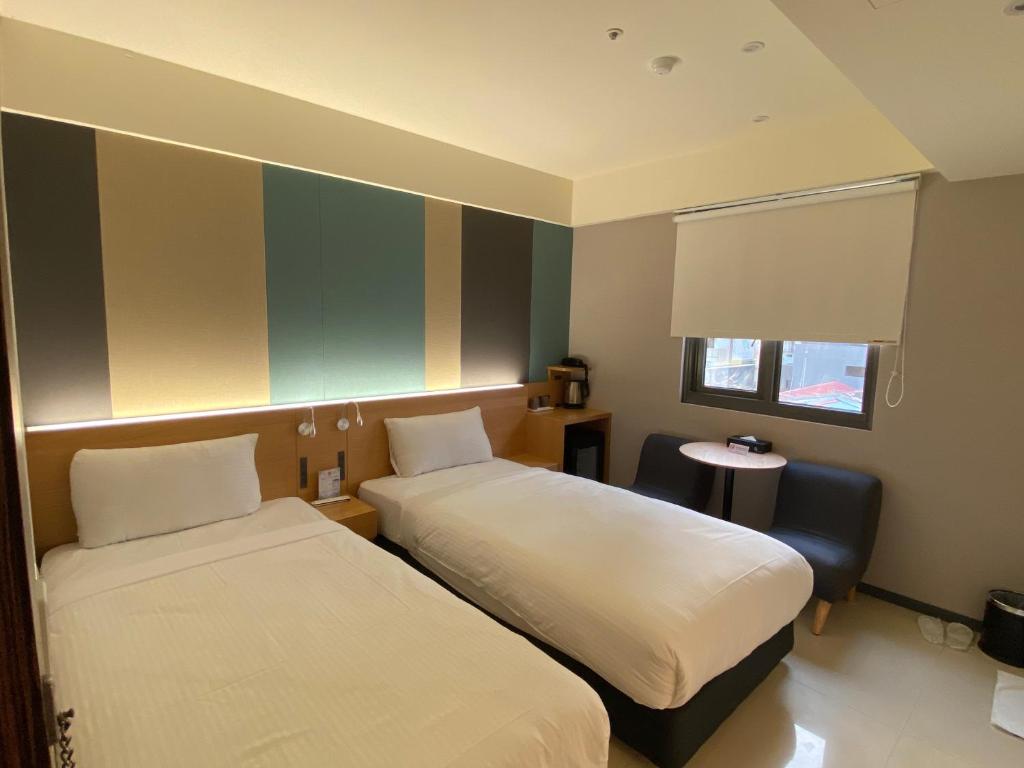 Letto o letti in una camera di Fu Kuang Hotel