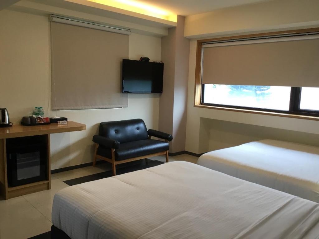 Letto o letti in una camera di Fu Kuang Hotel