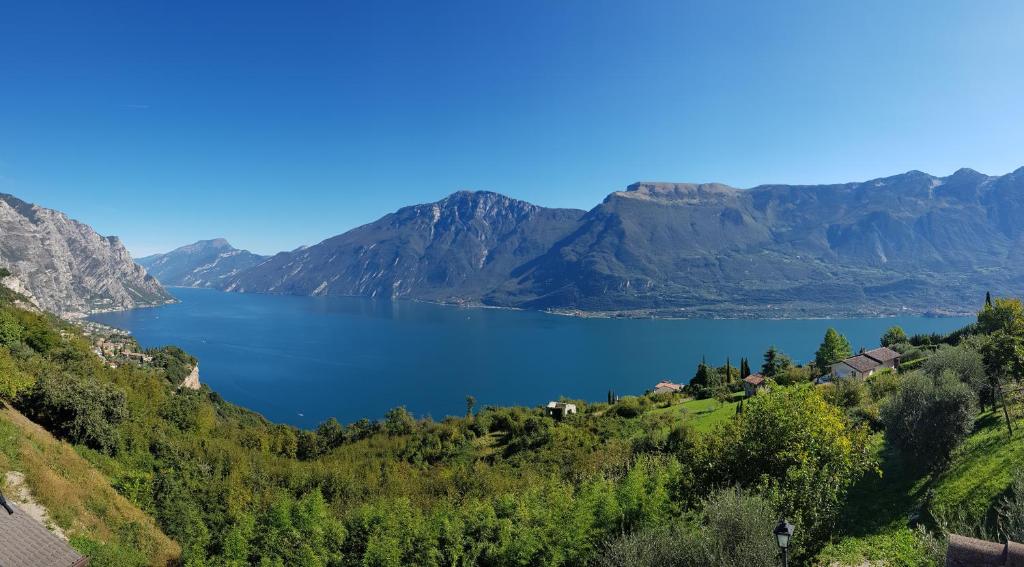 a view of a lake in the mountains at Villetta Vella Miralago by Garda Domus Mea in Tremosine Sul Garda