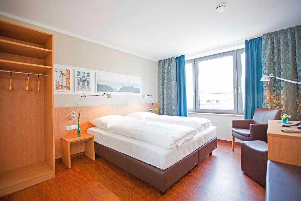 Postel nebo postele na pokoji v ubytování Sebcity Hotel