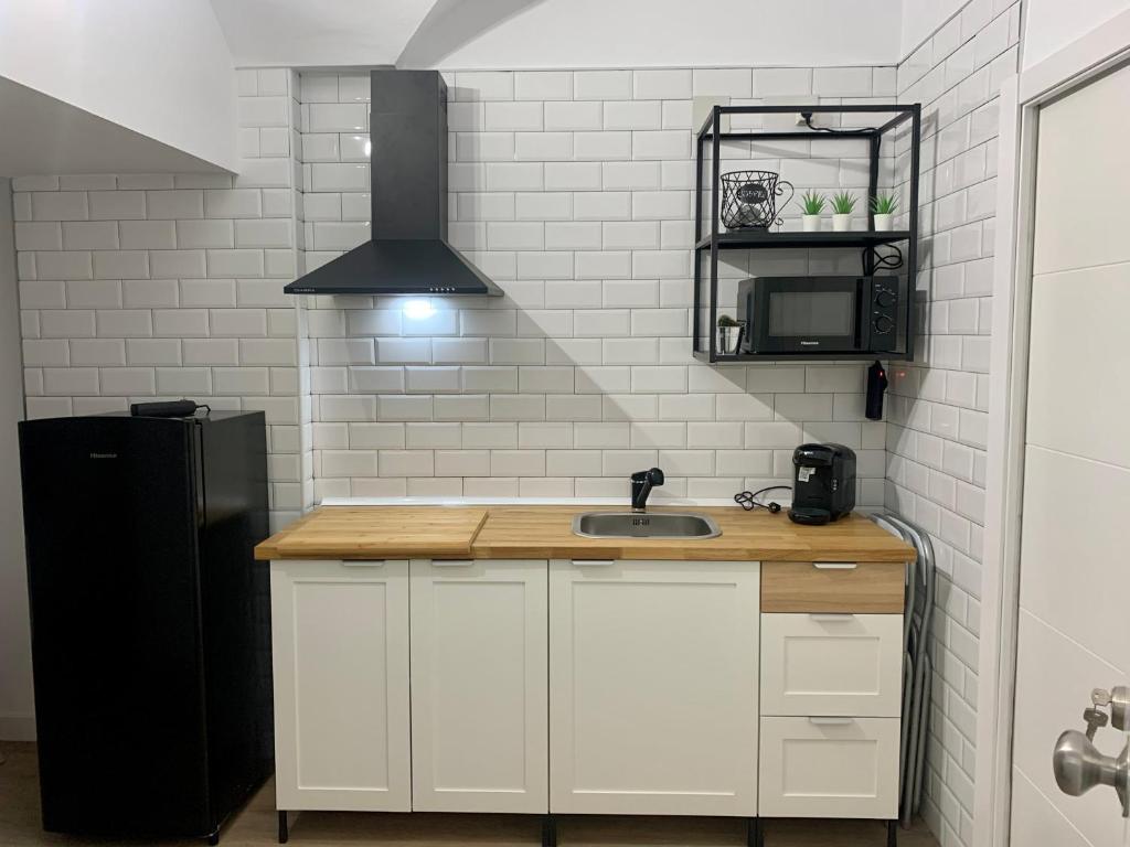 Kuchyň nebo kuchyňský kout v ubytování PUERTA DE CACERES Apartamento 2