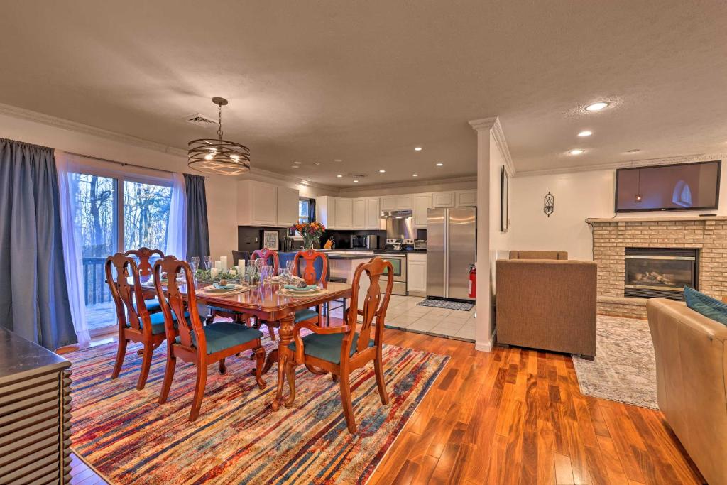 a kitchen and dining room with a table and chairs at Poconos Retreat Resort Perks, Lake Access! in Pocono Summit