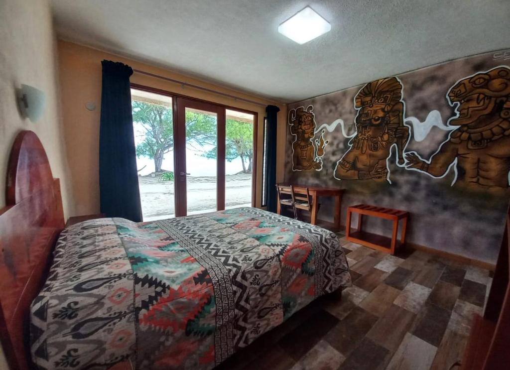 Postel nebo postele na pokoji v ubytování Xcalak Caribe Lodge