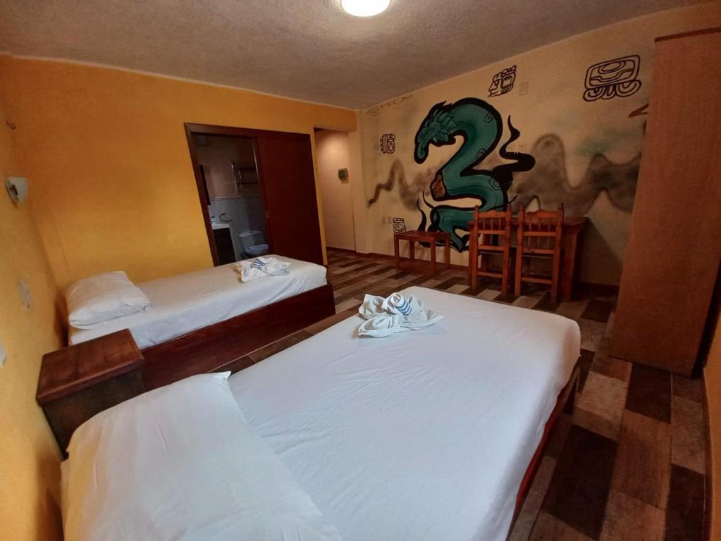 Postel nebo postele na pokoji v ubytování Xcalak Caribe Lodge