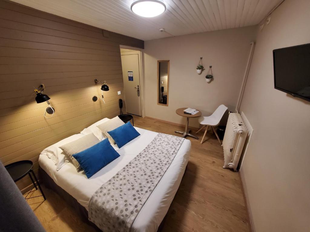 Postel nebo postele na pokoji v ubytování Le Grand Hotel