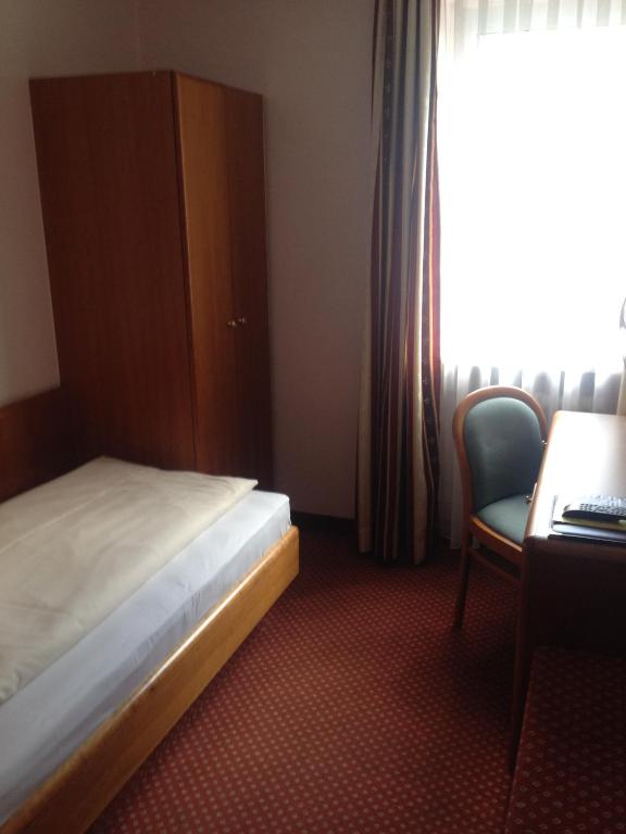 Postel nebo postele na pokoji v ubytování Hotel Carmen