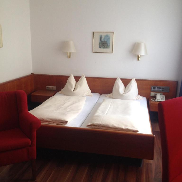 Postel nebo postele na pokoji v ubytování Hotel Carmen