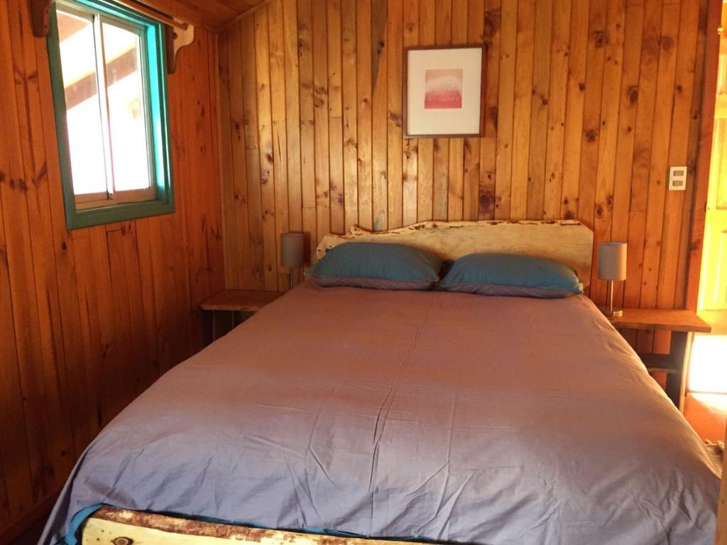 Uma cama ou camas num quarto em Hostel Raíz
