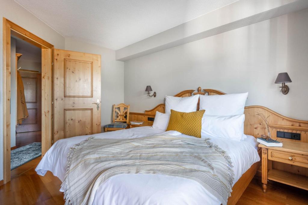 Postel nebo postele na pokoji v ubytování Boutique Hotel Bellevue Lermoos