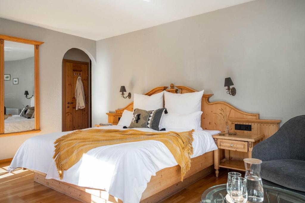 Postel nebo postele na pokoji v ubytování Boutique Hotel Bellevue Lermoos