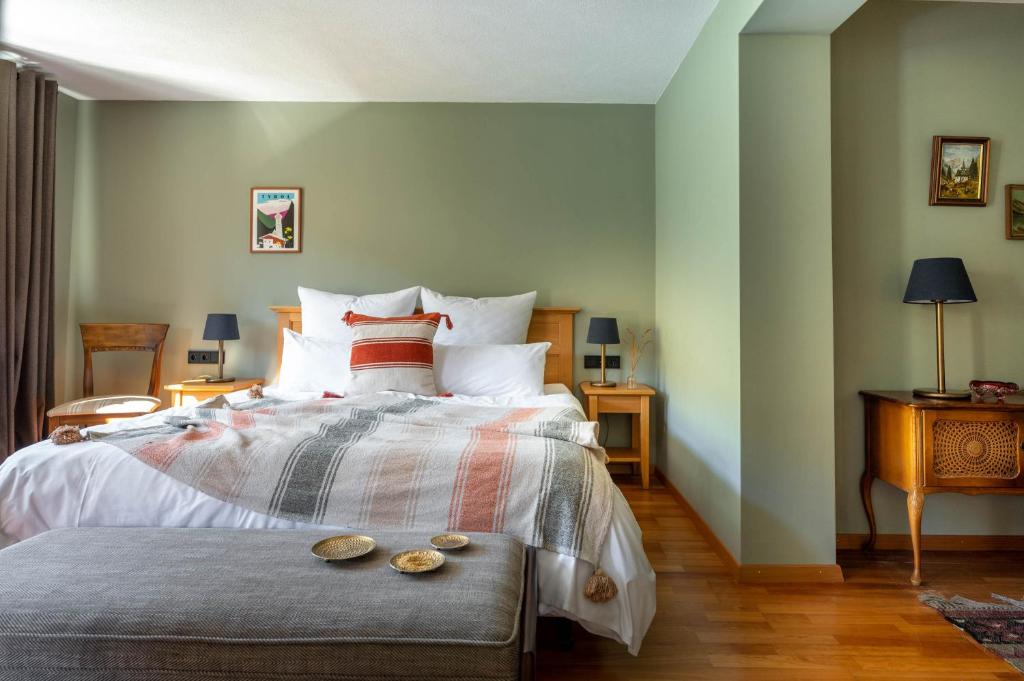 Postel nebo postele na pokoji v ubytování Boutique Hotel Bellevue Lermoos