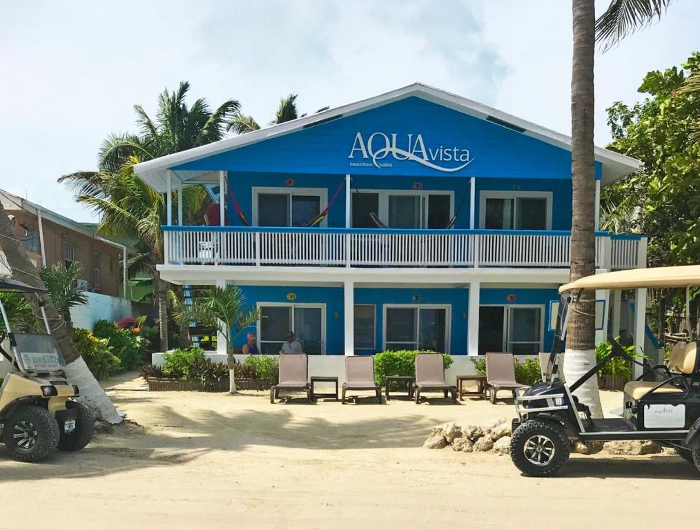 a blue building with chairs in front of it at Aqua Vista in San Pedro