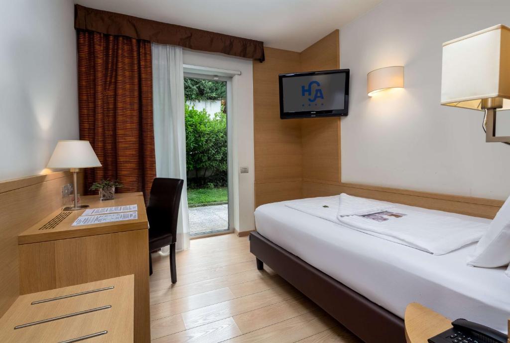 Llit o llits en una habitació de Best Western Hotel Adige