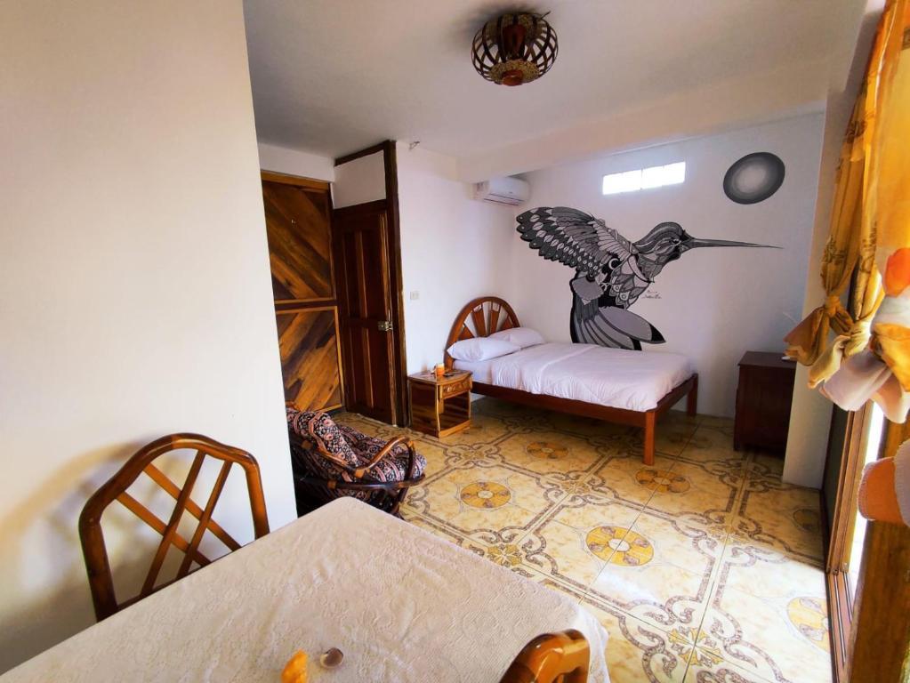 Postel nebo postele na pokoji v ubytování Hostal Mirada al Mar