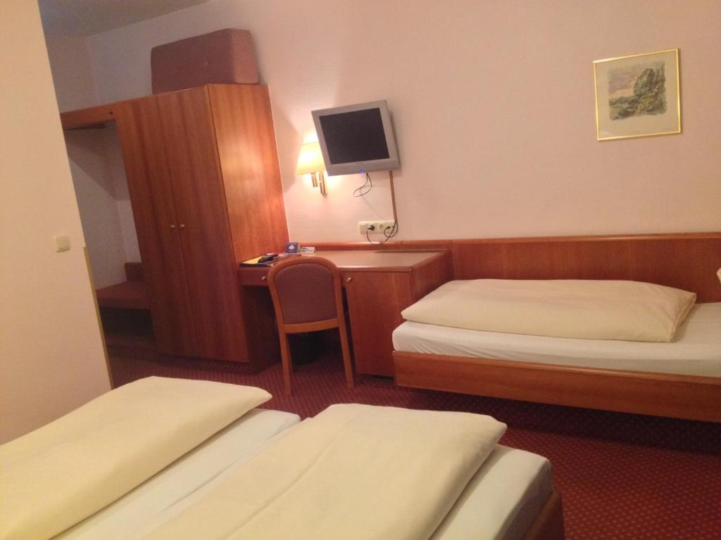 Postel nebo postele na pokoji v ubytování Hotel Carmen