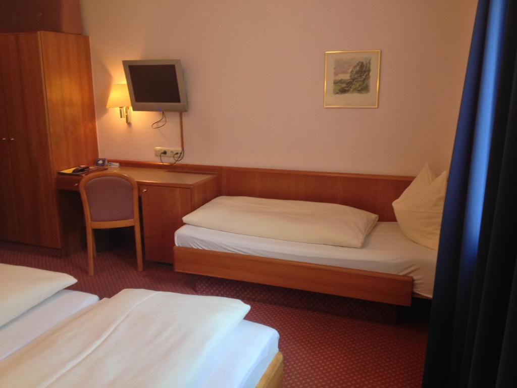 Postel nebo postele na pokoji v ubytování Hotel Carmen