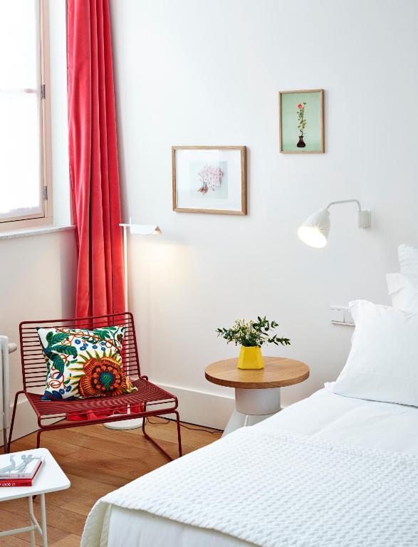 Postel nebo postele na pokoji v ubytování Hotel des Galeries