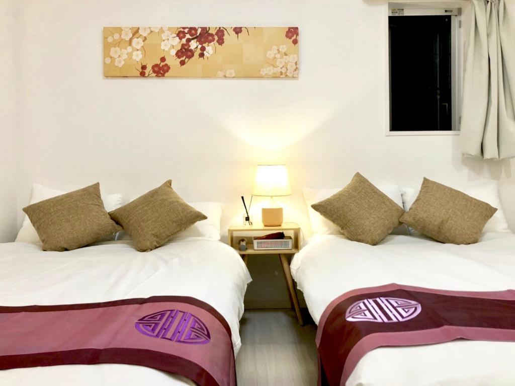 En eller flere senge i et værelse på リブシティ錦糸町参番館上層階スカイツリーの眺望