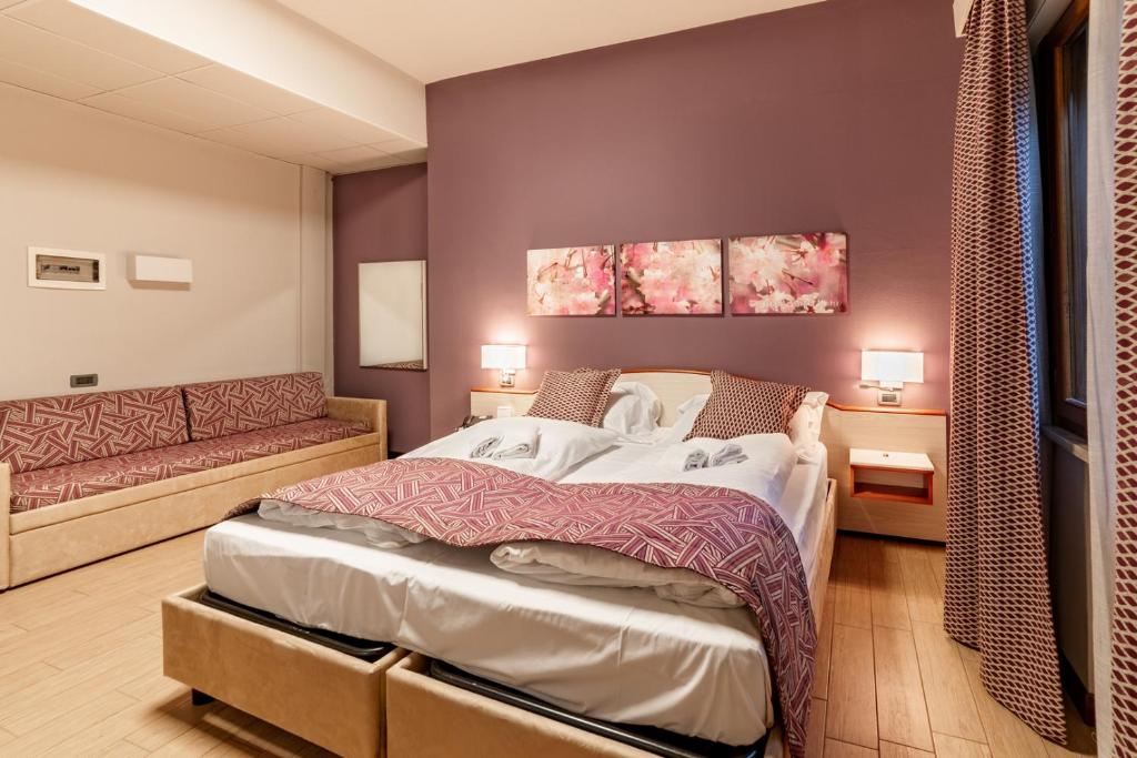 Łóżko lub łóżka w pokoju w obiekcie Hotel all'Orso