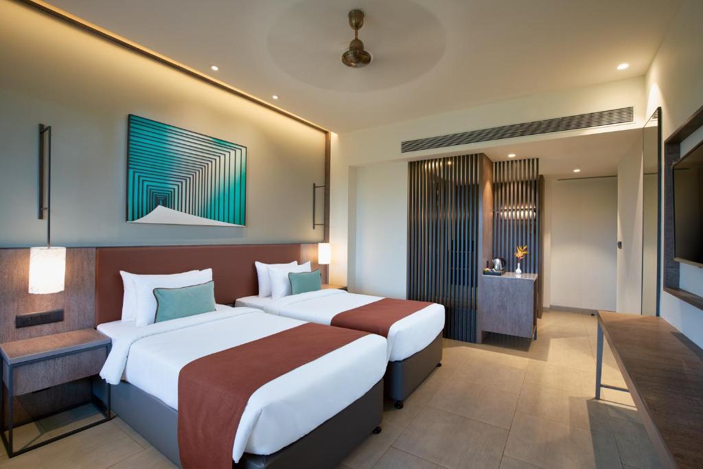 Postel nebo postele na pokoji v ubytování Amoravida By 7 Apple Resorts, Goa