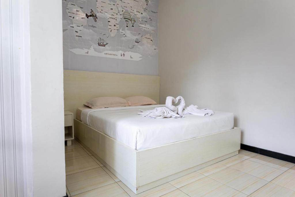 Postel nebo postele na pokoji v ubytování Batuque Town Villa
