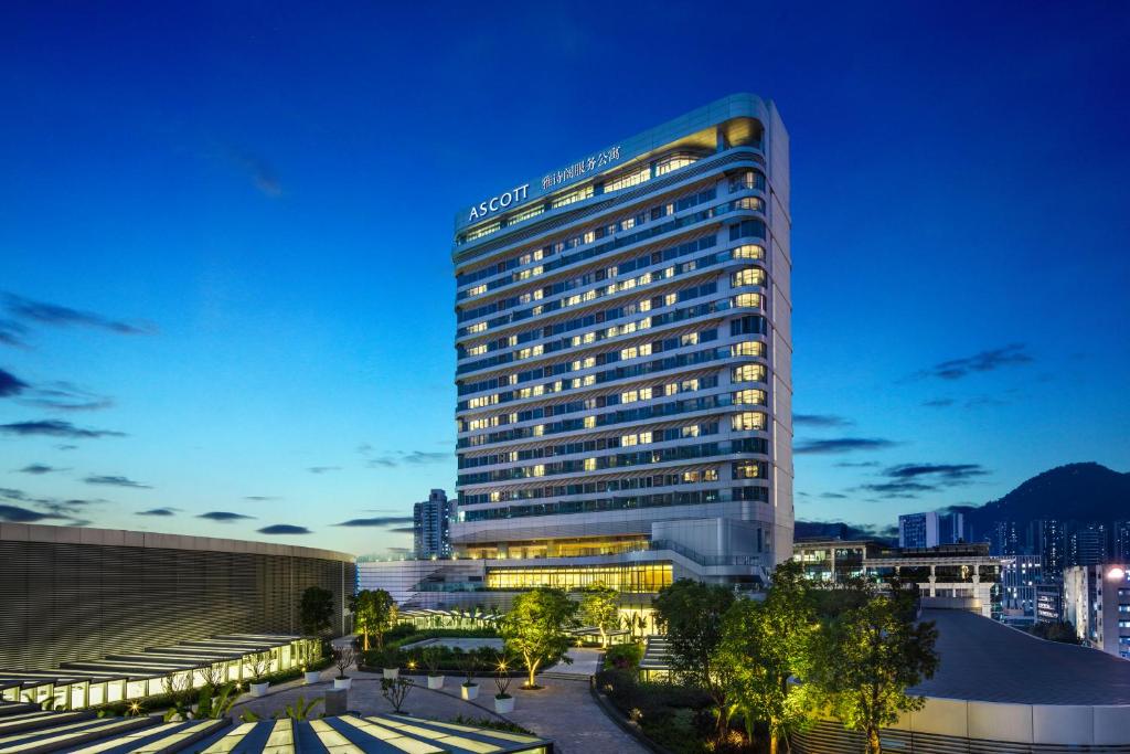 a rendering of a hotel building at night at Ascott Raffles City Shenzhen in Shenzhen