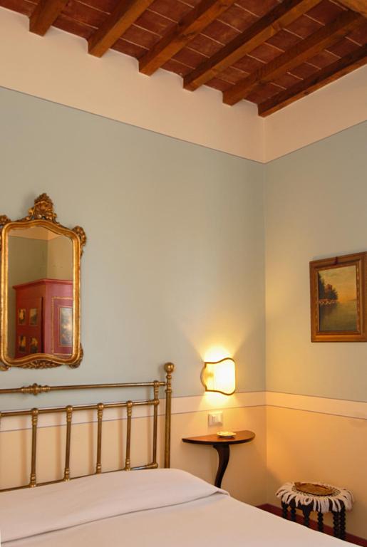 Postel nebo postele na pokoji v ubytování Il Rondò Boutique Hotel