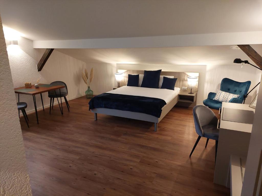 Postel nebo postele na pokoji v ubytování Apart-Hôtel Pont-de-Thielle
