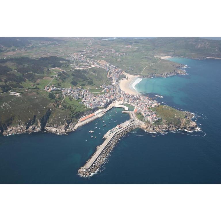 an aerial view of a beach and the water at Apartamentos Nordés2 in Malpica