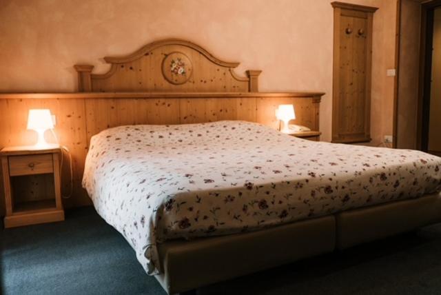 Postel nebo postele na pokoji v ubytování Hotel Primiero