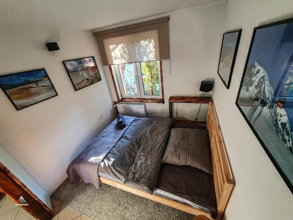 En eller flere senge i et værelse på Tatratour. Apartament u Przewodników.