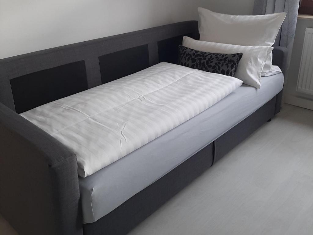 Postel nebo postele na pokoji v ubytování Bugenhagen - Classic Appartements
