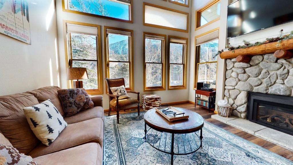 a living room with a couch and a fireplace at Snowcreek #890 condo in Mammoth Lakes