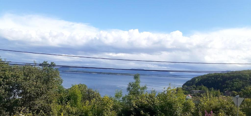 a view of a body of water with power lines at tau bed and breakfast in Strand
