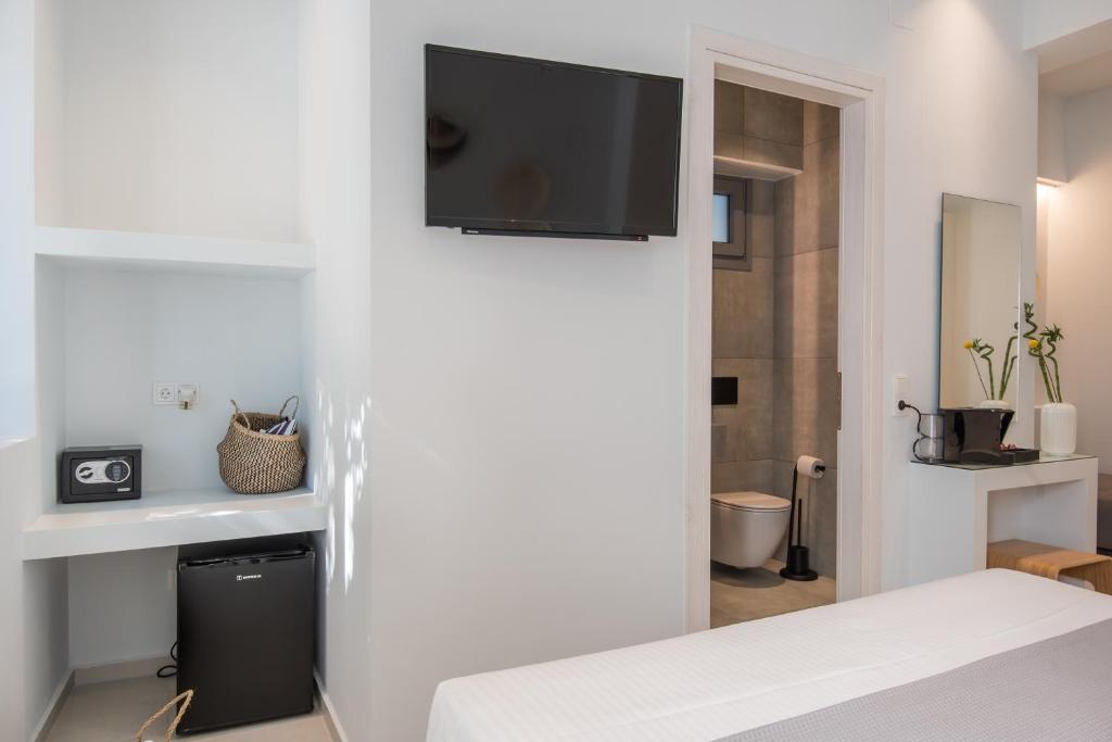 TV a/nebo společenská místnost v ubytování Rivière Residence Paros