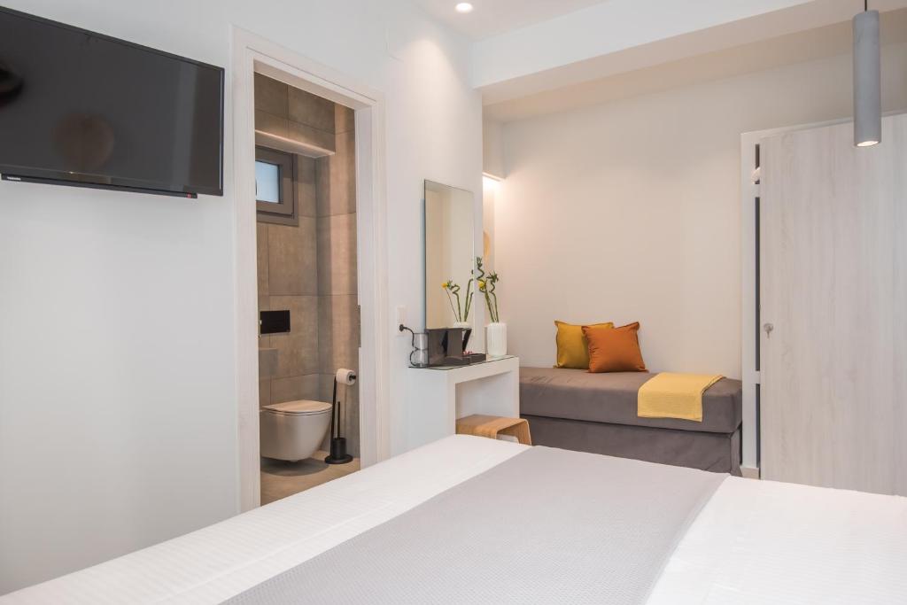 Postel nebo postele na pokoji v ubytování Rivière Residence Paros