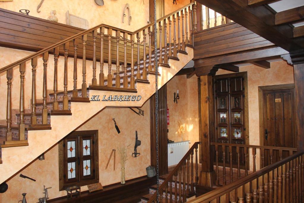 an overhead view of a staircase in a house with wooden railings at EL LABRIEGO, Casa rural in Fuente el Fresno