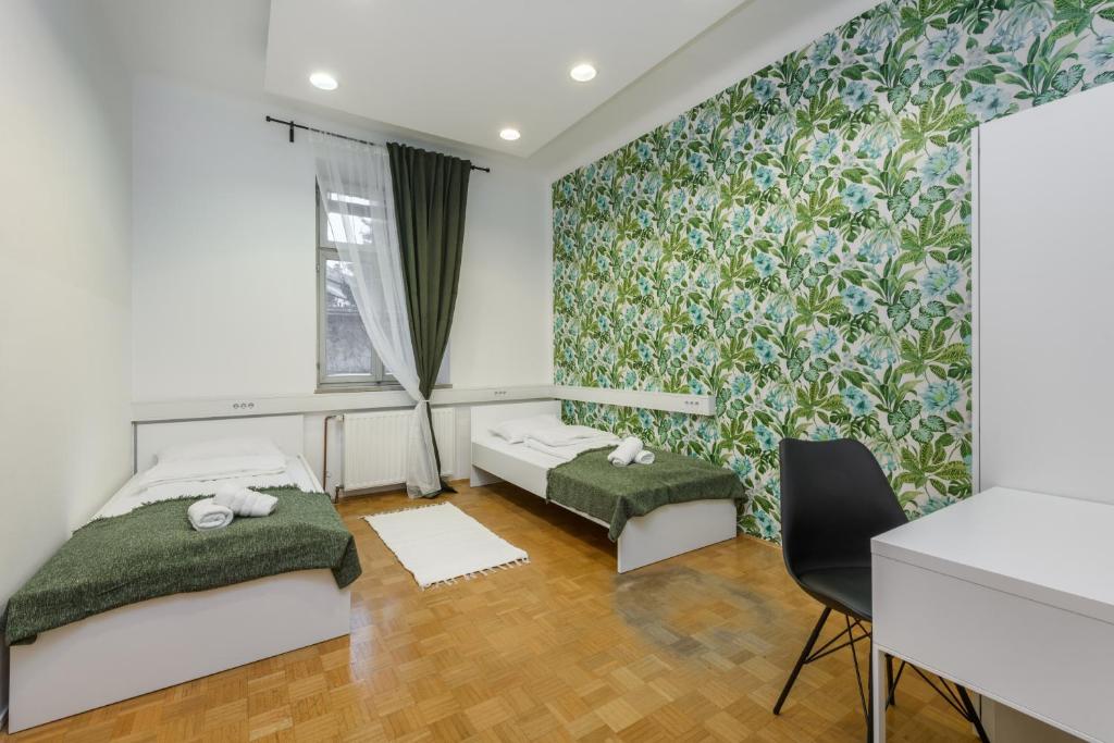 Postel nebo postele na pokoji v ubytování ROYAL ROOMS***